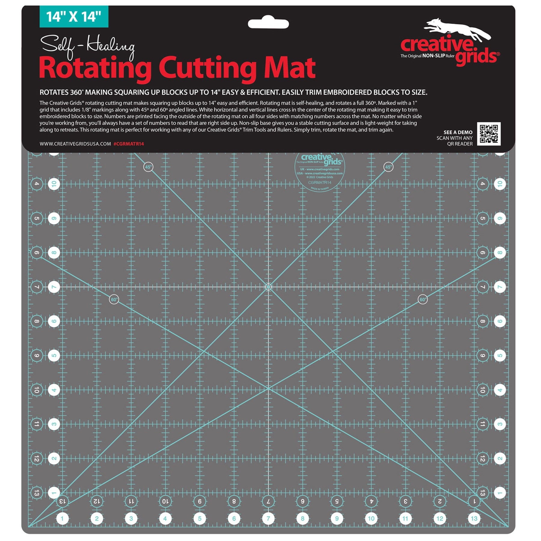 A 14x14 inch creative grids self-healing rotating cutting mat in dark gray with light blue grid lines and white measurement markings, shown on its black retail backing card.