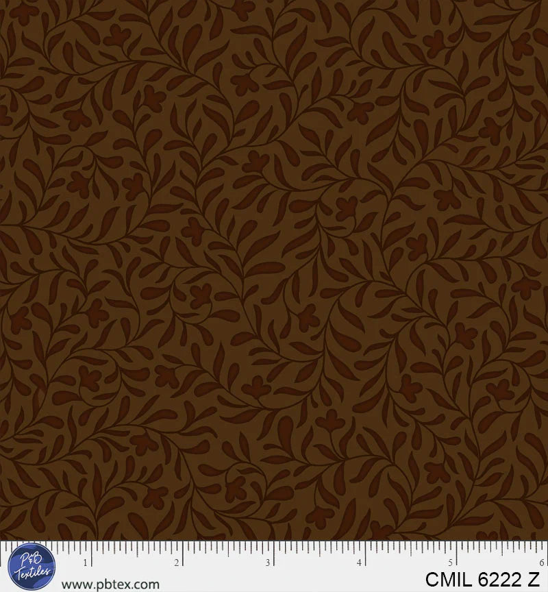 Dark fabric texture with a ruler at the bottom for scale.