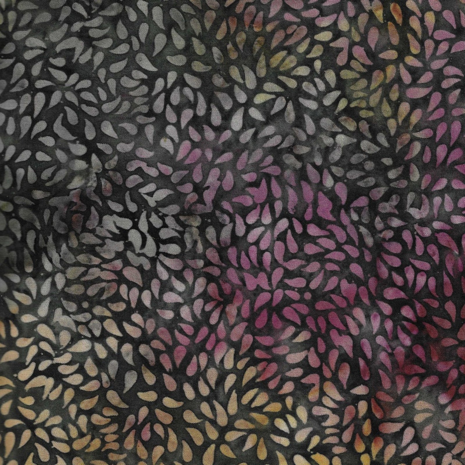 Patterned fabric with multicolored abstract design on a dark background