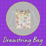 Colorful drawstring bag featuring butterflies, flowers, and circular motifs, finished with white drawstrings.