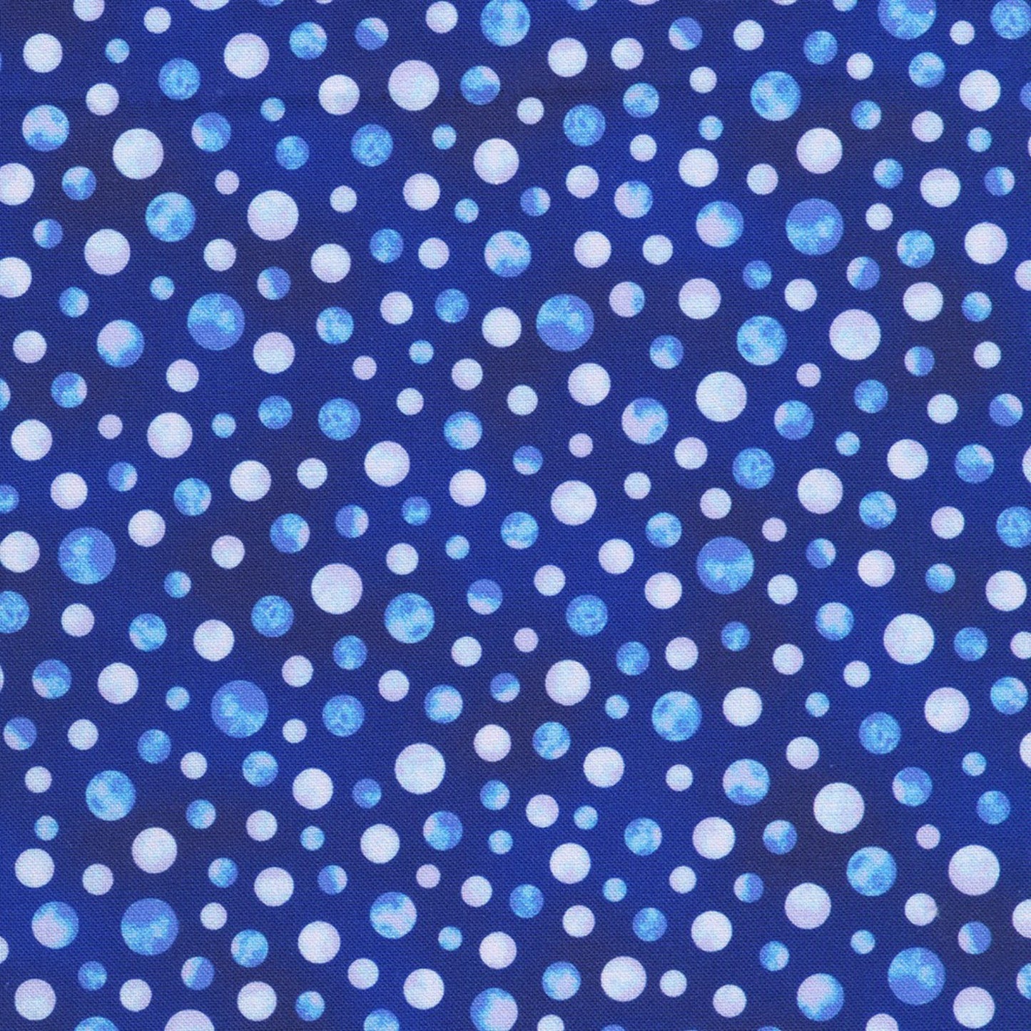 Pattern of blue and white polka dots on a blue background