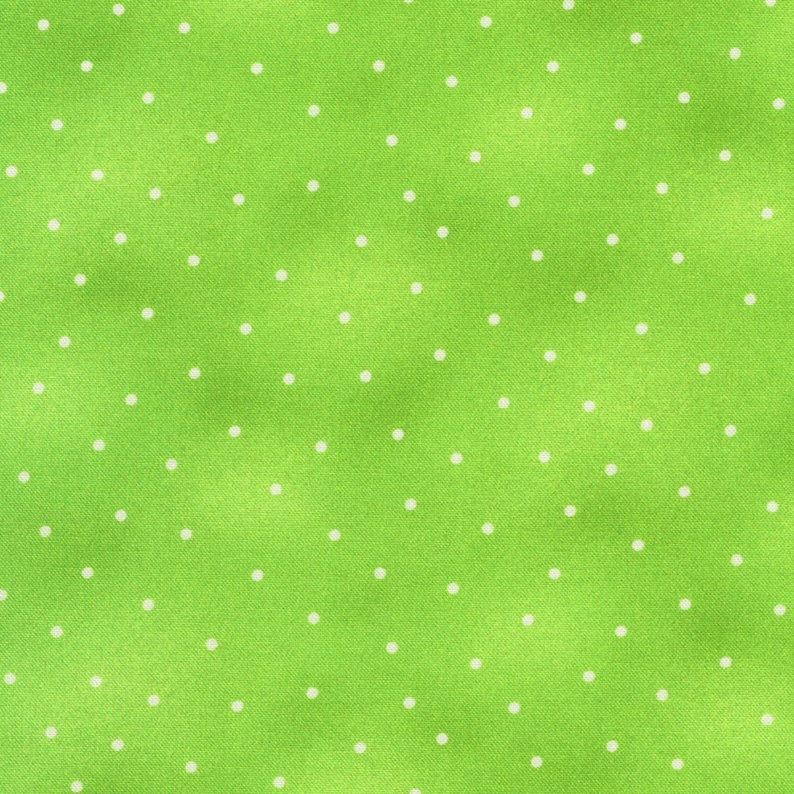 A close-up of a bright lime green textured surface with a repeating pattern of small white polka dots.