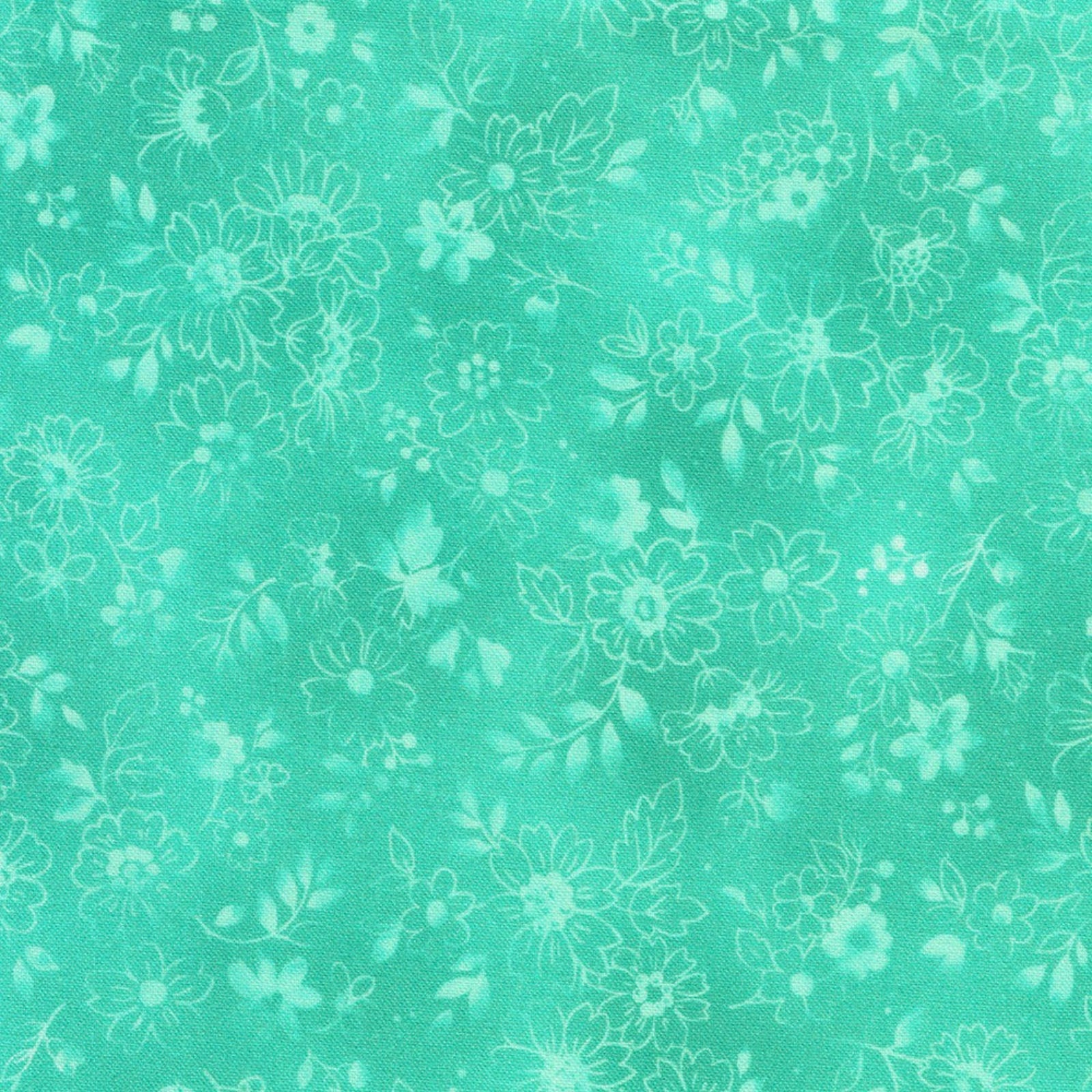 A close-up of a mint green fabric with a repeating white floral pattern.