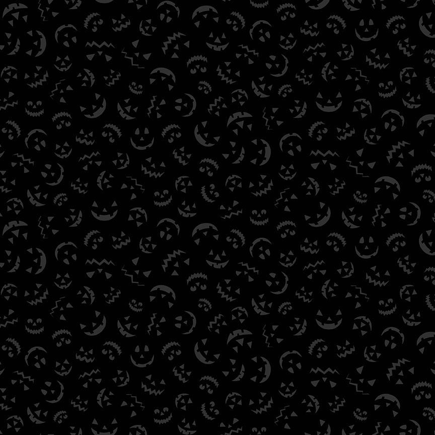 Black background with small jack o' lantern faces