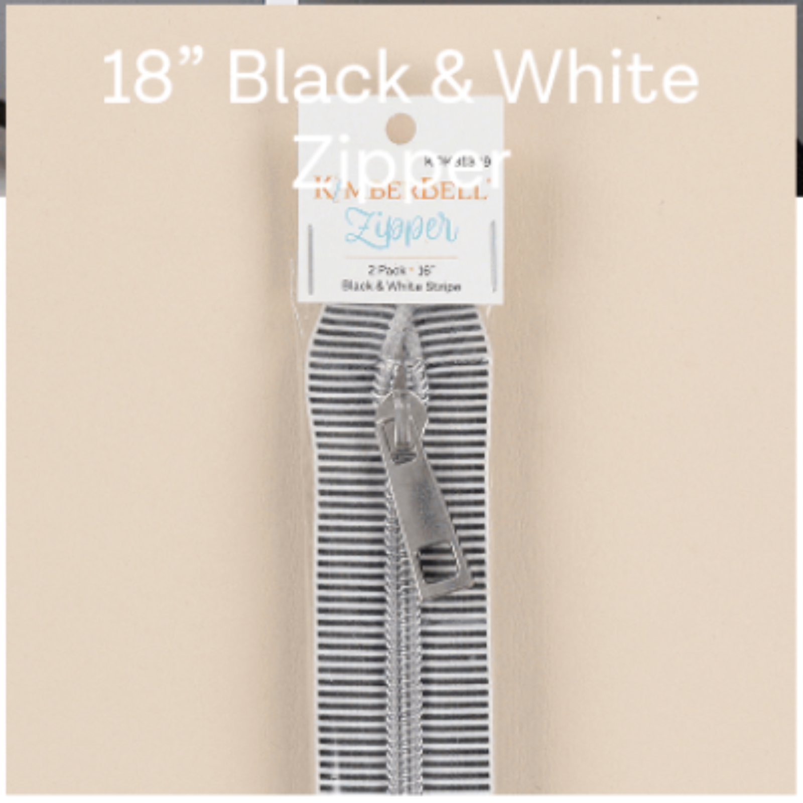 Packaged black and white zippers with a visible brand label on a beige background