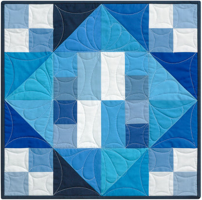 Quilt with blue and white geometric pattern