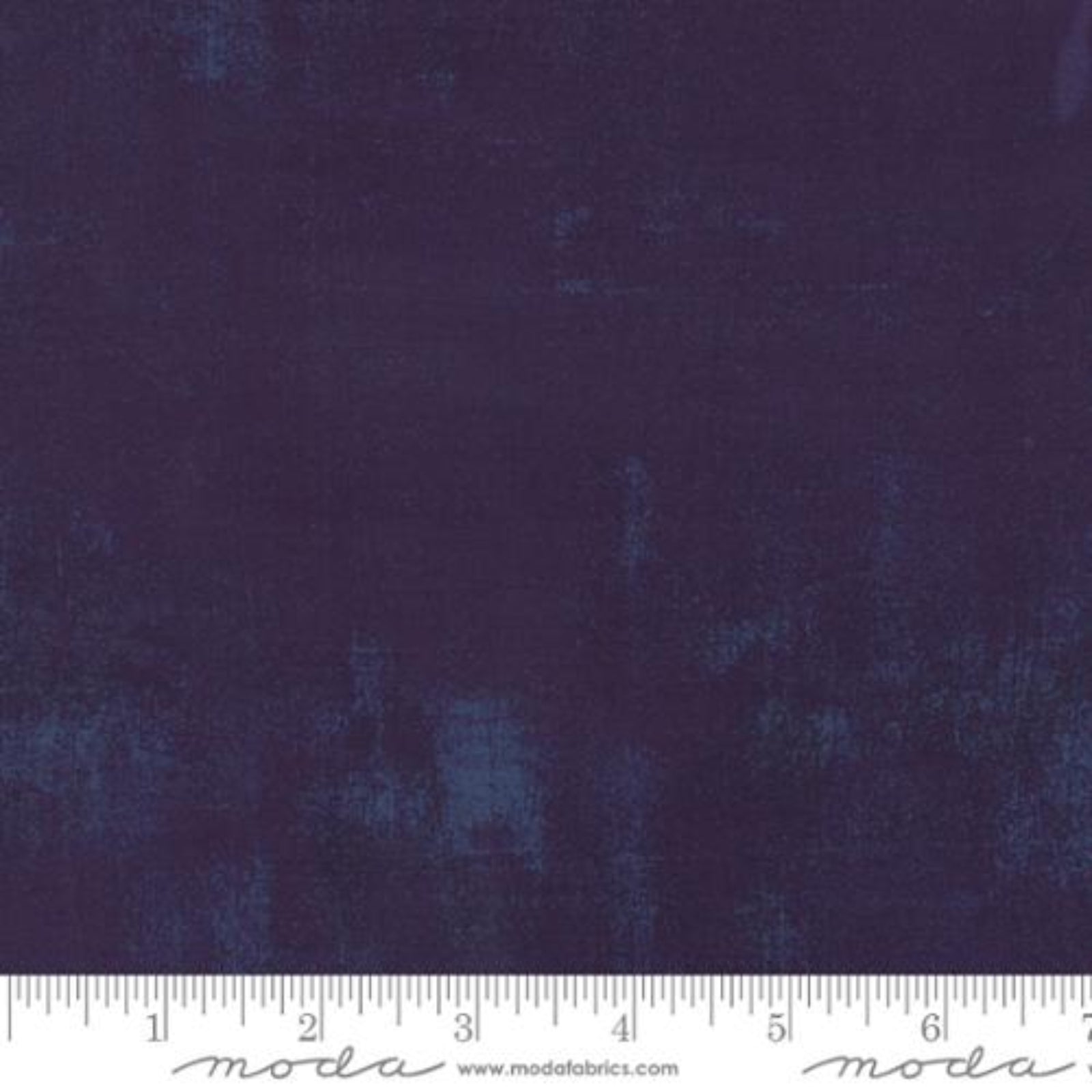 Navy deep purple fabric with a subtle pattern and a ruler at the bottom for scale.