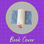 Handmade fabric book cover with a bright blue and pink floral lining, shown open.