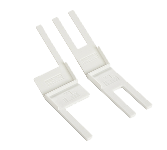 Two white plastic clips on a black background