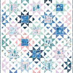 A square quilt pattern featuring a repeating geometric block design with white X-shaped triangles, light blue and mint green triangles, and small printed fabric squares with blue and pink winter-themed illustrations.