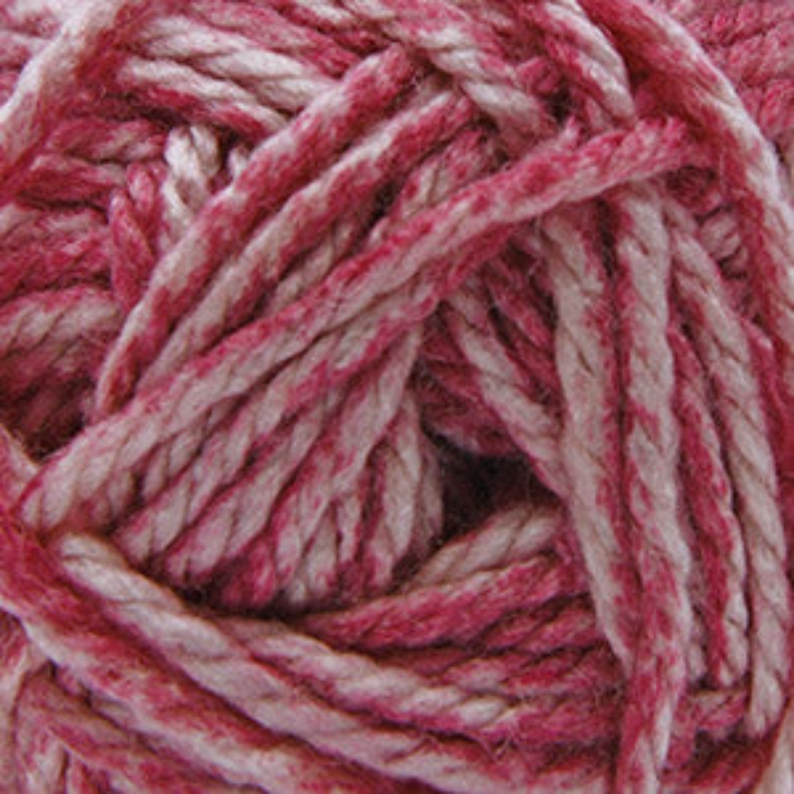 A close-up of variegated yarn with alternating strands of dusty rose pink and off-white.