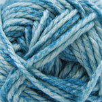 A close-up of variegated yarn in shades of light blue, medium blue, and white.