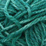 A close-up of teal green yarn strands twisted together, filling the frame.