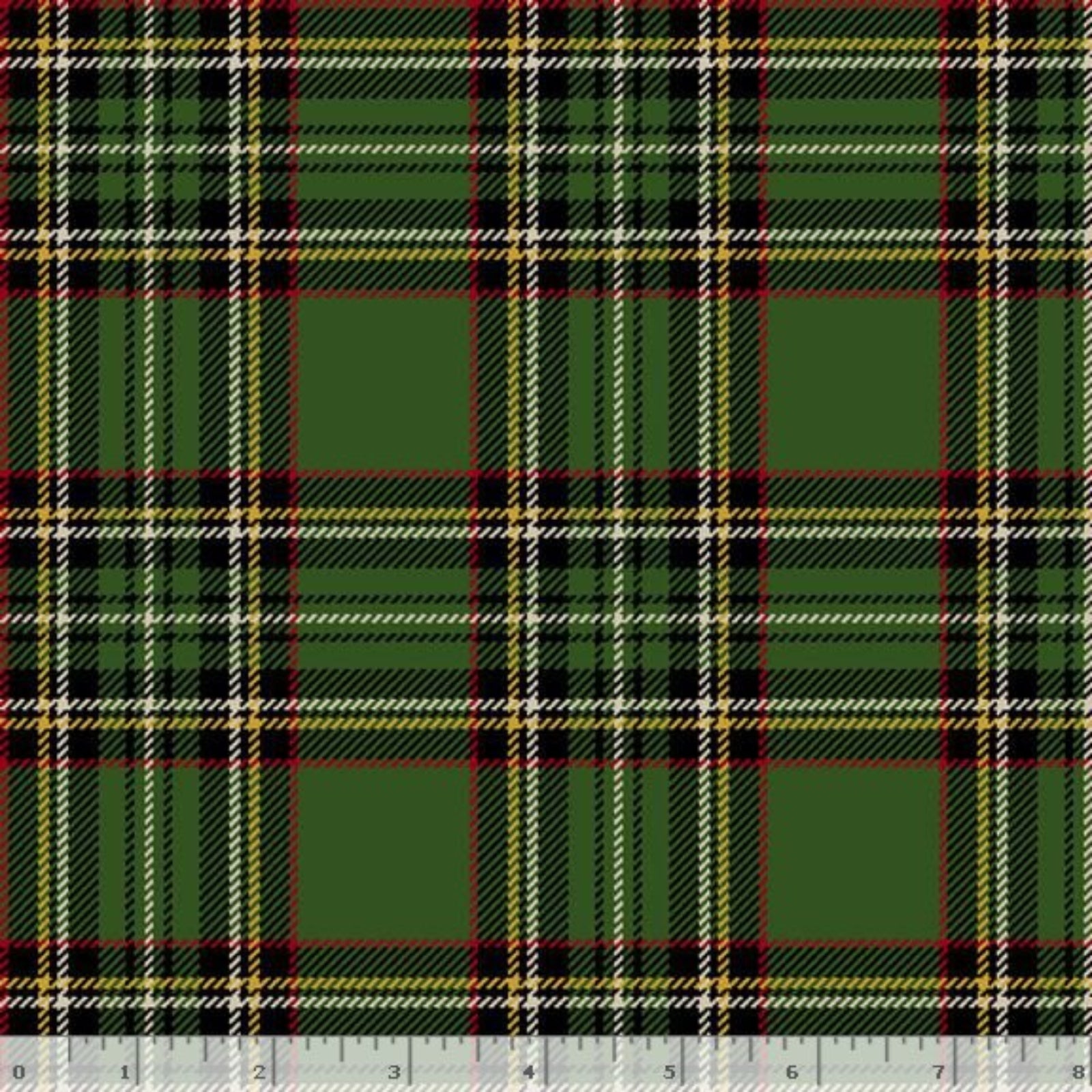 A close-up of a green tartan plaid fabric pattern with black, red, and cream stripes, shown with a white ruler at the bottom edge for scale.