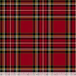 A close-up of a red tartan plaid fabric pattern with black, white, and thin gold stripes, shown flat with a ruler along the bottom edge for scale.