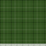 A close-up of a green plaid fabric pattern with intersecting dark and light stripes, shown flat with a ruler along the bottom edge for scale.
