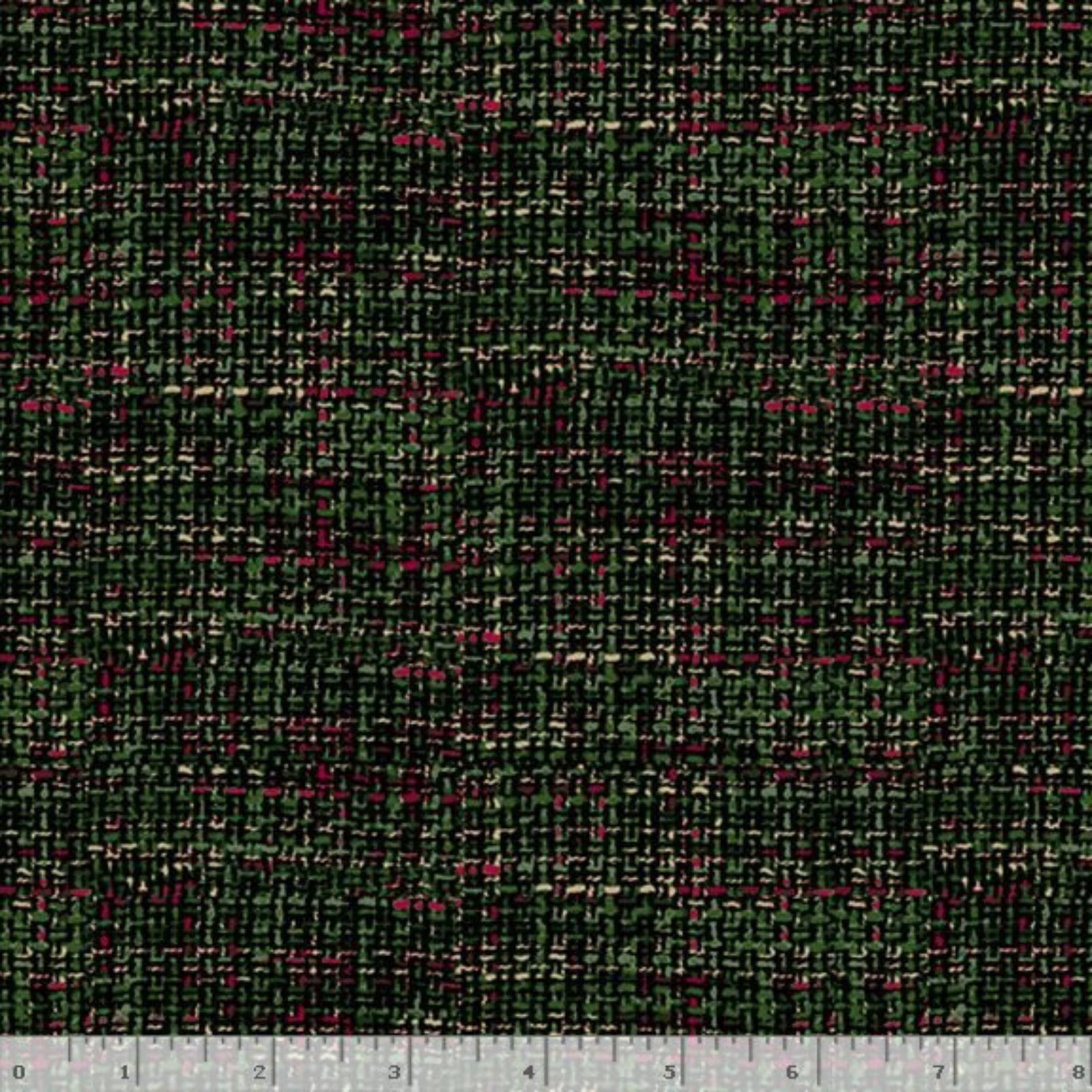 A close-up of a woven fabric texture with a dark green and black plaid pattern, accented with small pink and beige flecks. A ruler is visible along the bottom edge for scale.