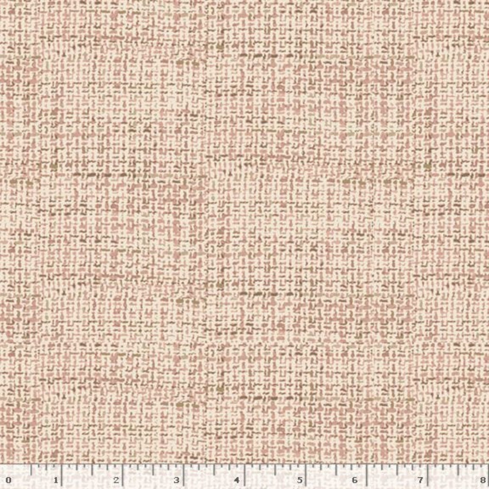 A close-up of a woven fabric texture in a warm beige and light brown herringbone pattern, with a white ruler along the bottom edge showing measurement markings.