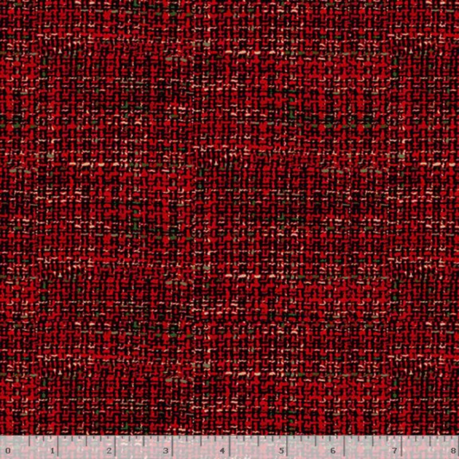A close-up of a woven fabric texture in a red and black plaid pattern, with a white ruler at the bottom edge showing scale.