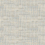 A close-up of a woven fabric texture with a small-scale geometric pattern in light blue, beige, and off-white.