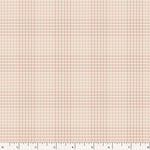 A close-up of a fabric pattern showing a fine plaid and small houndstooth-like check in soft blush pink and warm beige, with a white ruler along the bottom edge for scale.