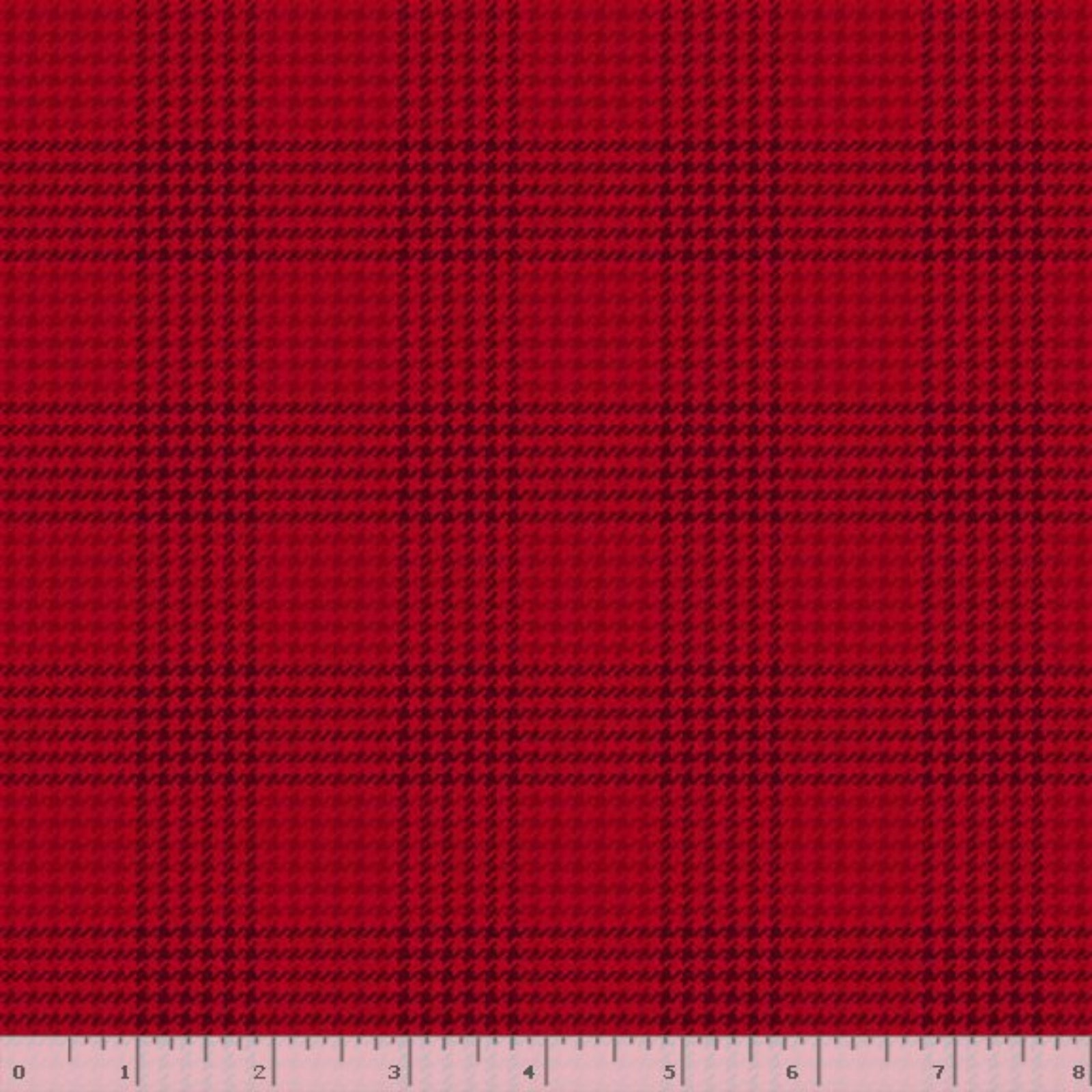 Red and black plaid fabric pattern shown flat, with a small ruler strip along the bottom edge for scale.