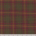 A close-up of a plaid fabric pattern with olive green, burgundy red, and mustard yellow stripes, with a white ruler at the bottom showing measurement markings.