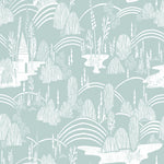A repeating illustrated pattern of a whimsical landscape with pale mint green and white stylized trees, hills, arches, and a small house, shown as a full-frame design rather than a photographed object.