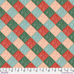 A repeating diamond patterned fabric design with coral pink, red, sage green, and light blue sections, each filled with a white branch or leaf motif. A white ruler along the bottom edge shows measurements in inches.