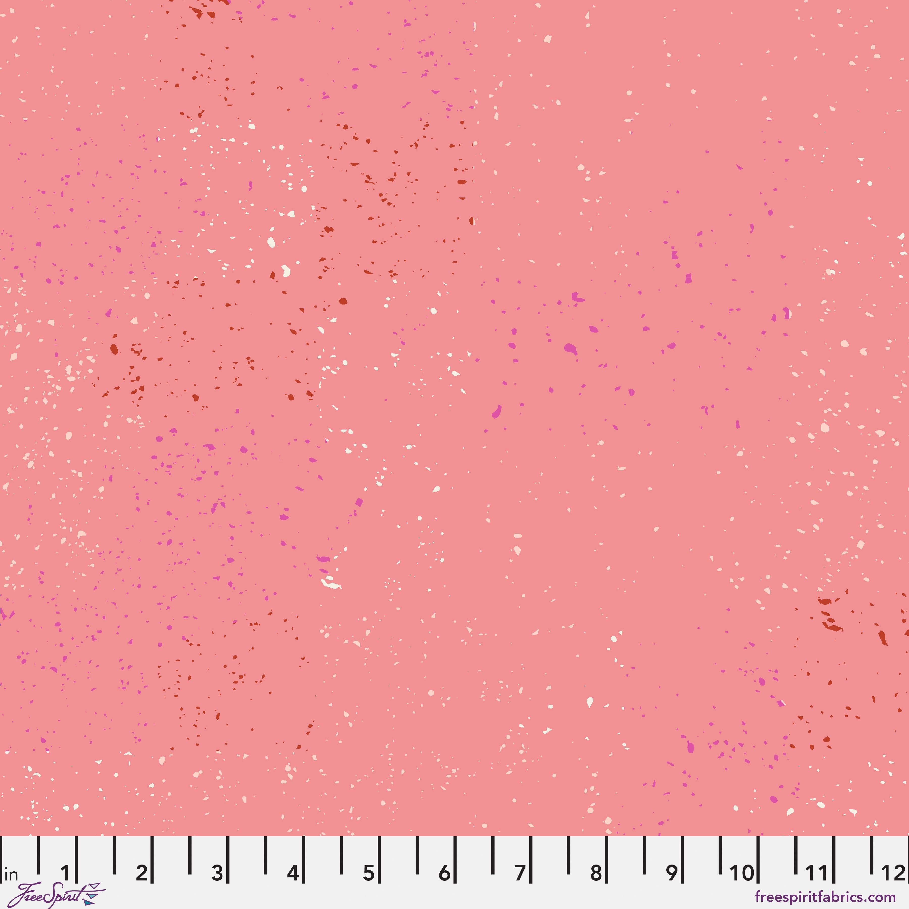 Pink fabric with small specks of red, purple and cream on a pink background