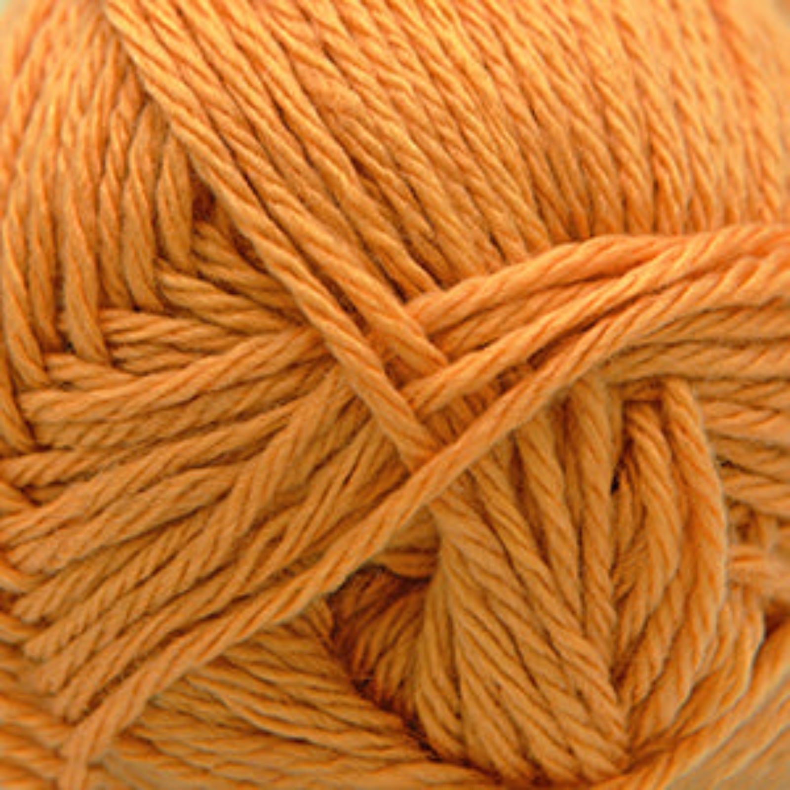Close-up of a ball of yellow-orange yarn