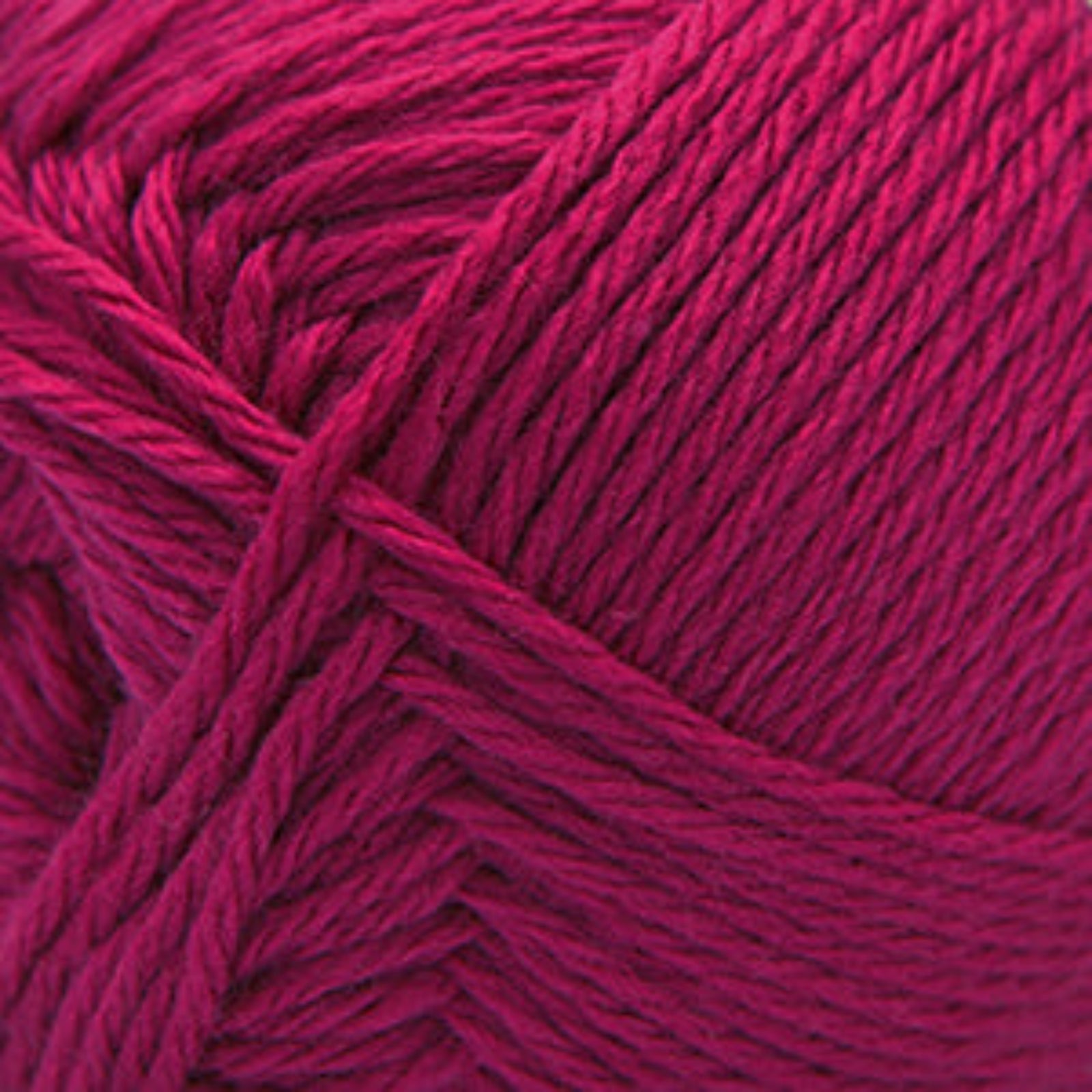 Close-up of bright pink yarn with a textured pattern