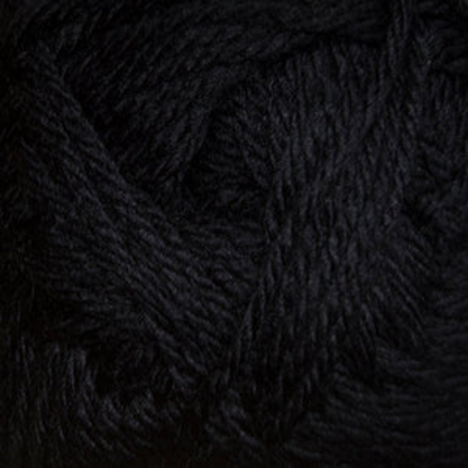Close-up of dark black yarn on a black background