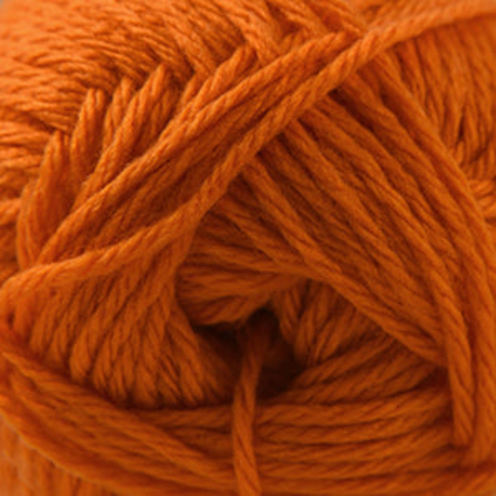 Close-up of an orange ball of yarn