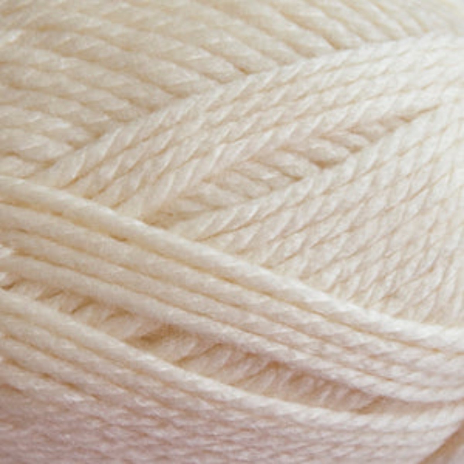 Close-up of beige yarn with a soft texture