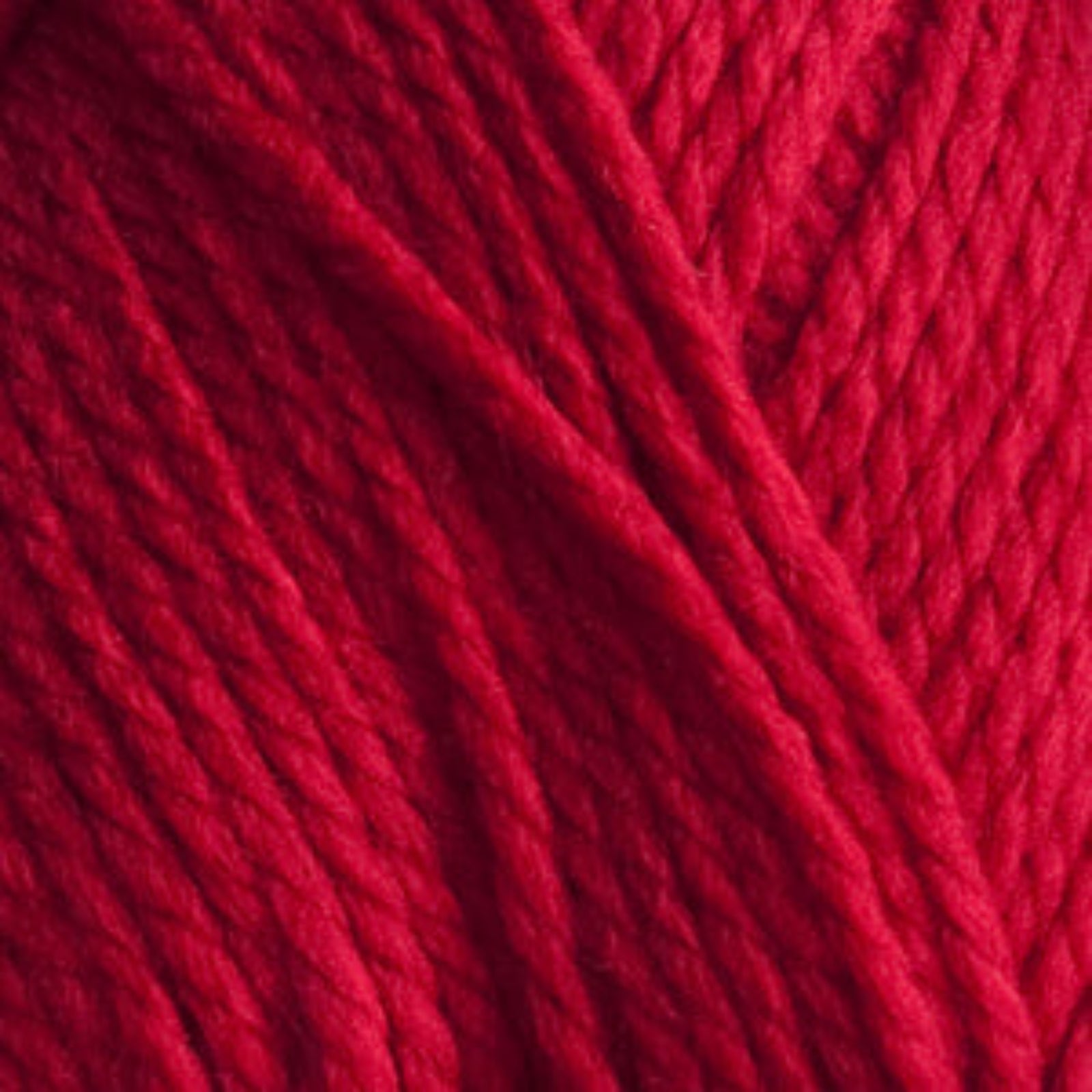 Close-up of red yarn with a textured pattern