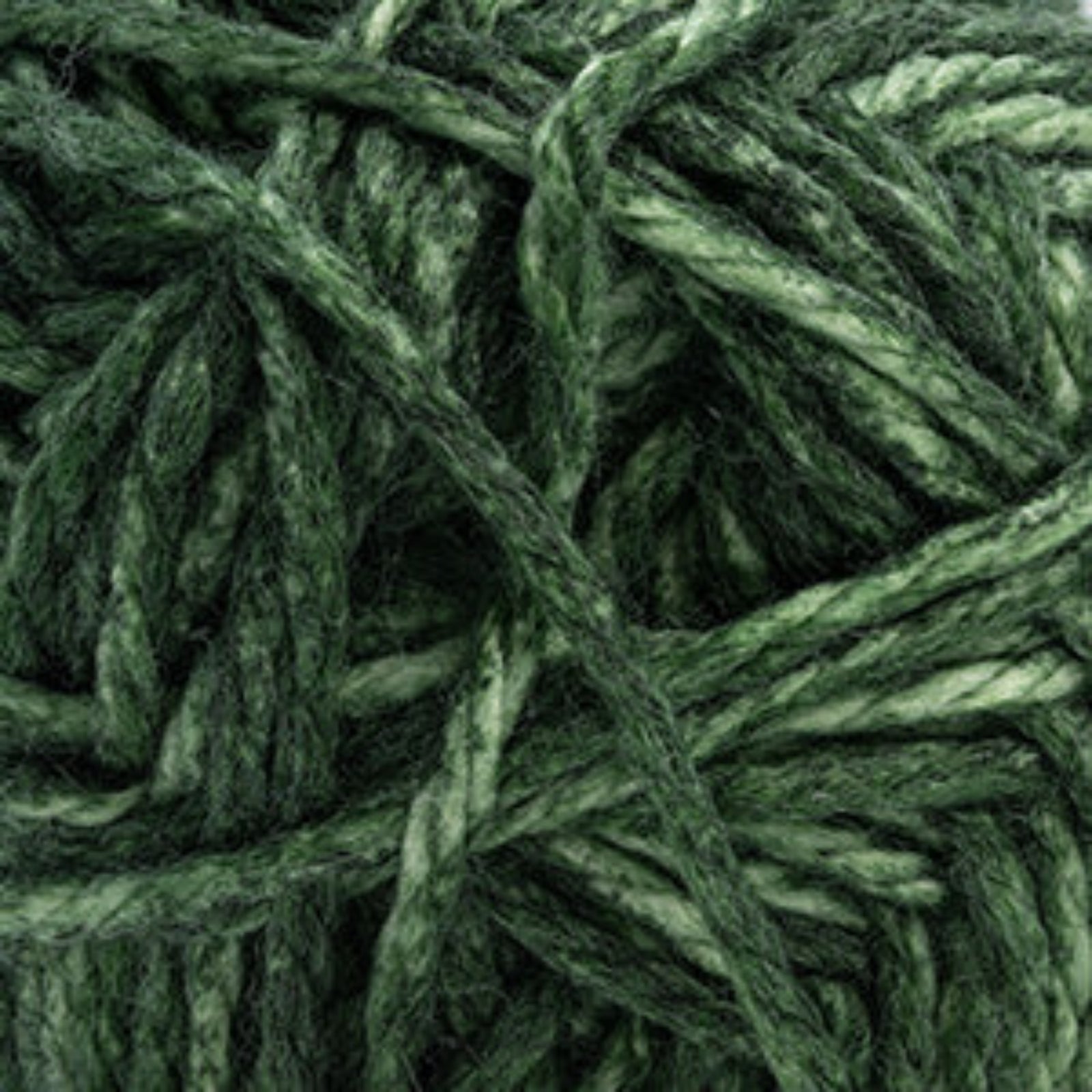 A close-up of dark green variegated yarn strands, showing the fuzzy texture and twisted ply structure of the fiber.