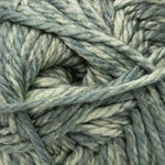 Close-up of variegated yarn with a mottled blend of grey, light blue, and cream fibers twisted into strands.