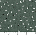 Dark green fabric with a white daisy floral pattern and a ruler scale at the bottom indicating inches.