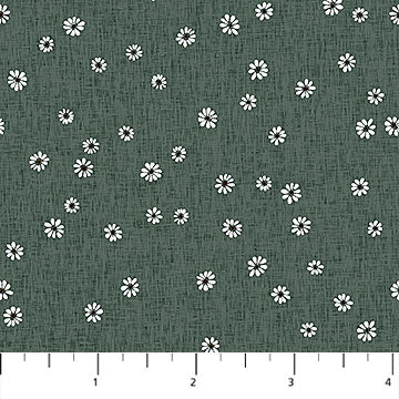 Dark green fabric with a white daisy floral pattern and a ruler scale at the bottom indicating inches.