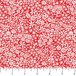 Red and white floral patterned fabric with a ruler scale visible along the bottom edge.