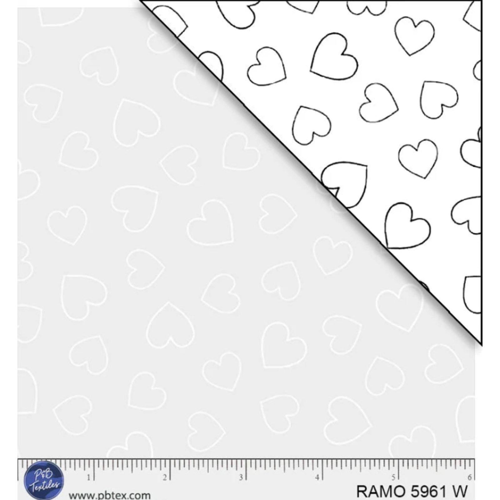 White fabric with black heart pattern and a ruler at the bottom for scale.