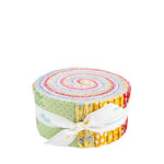 A rolled bundle of Riley Blake fabric scraps tied with a white ribbon, showing a colorful spiral pattern of various fabrics on a plain white background.