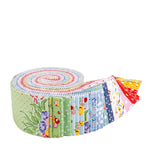 A roll of colorful quilted fabric with various floral and patterned designs fanned out on a white background.