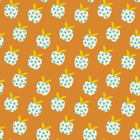 Pattern of blue and white polka dot apples with green leaves on a brown background