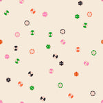 Pattern of colorful buttons shapes on a beige background