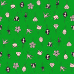 Pattern of various small illustrations on a threader with a green background