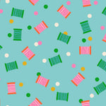 Colorful spools of thread pattern on a blue background