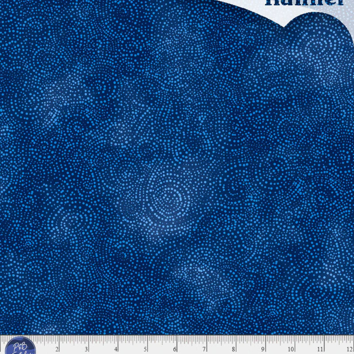 Blue flannel fabric with a ruler at the bottom for scale