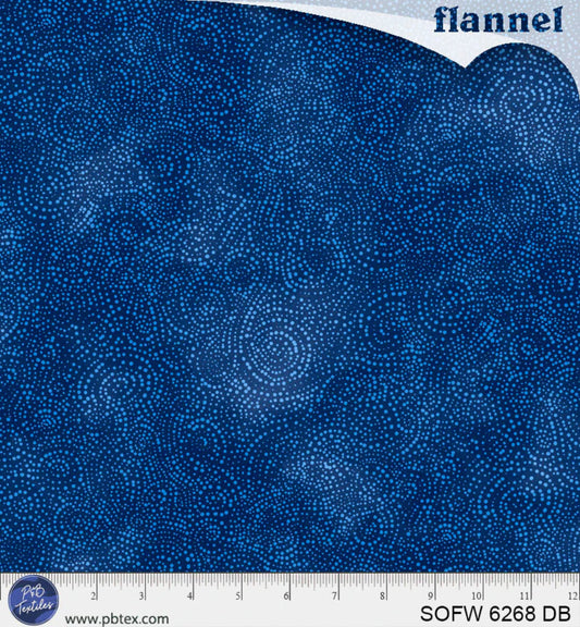 Blue flannel fabric with a ruler at the bottom for scale